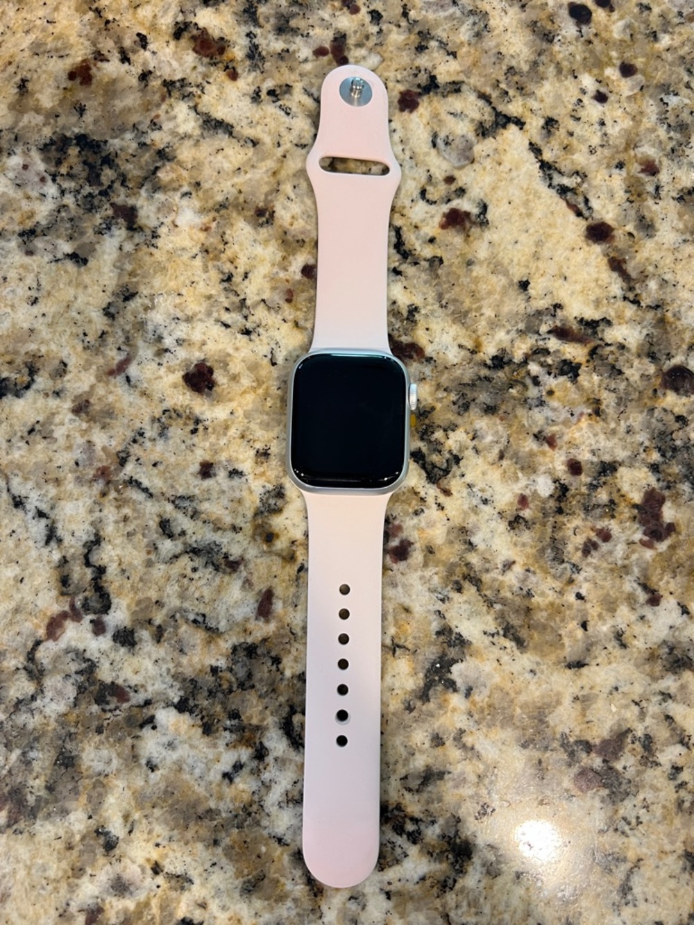 Silver Apple Watch with pink Silicone Band, series 9